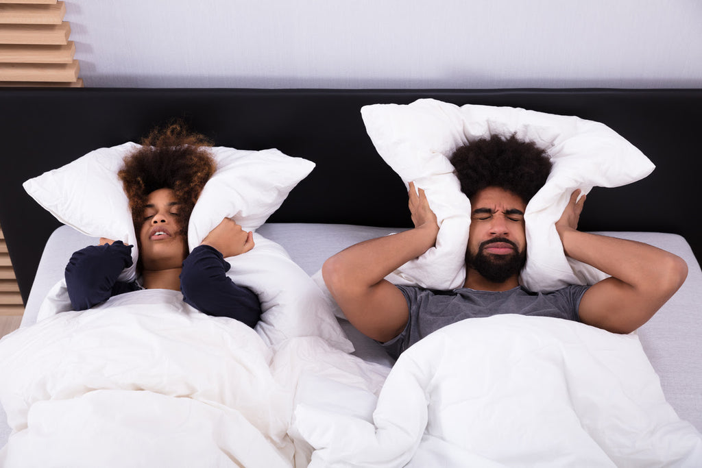 Noise pollution affecting a couple in bed that can't sleep Noise pollution affecting a couple in bed that can't sleep
