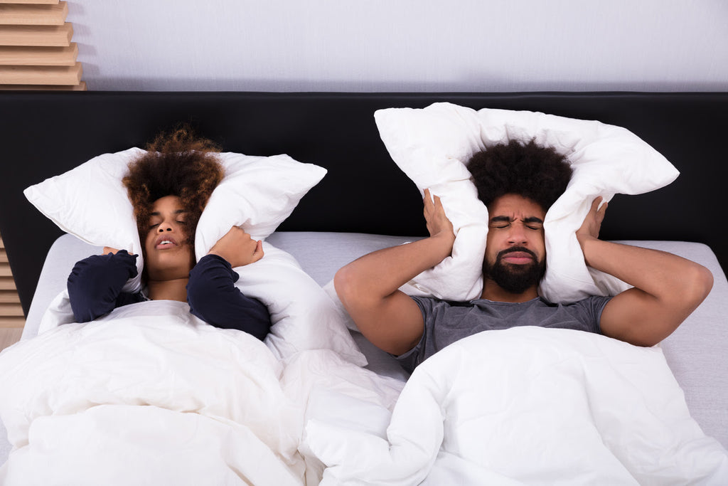 Noise pollution affecting a couple in bed that can't sleep