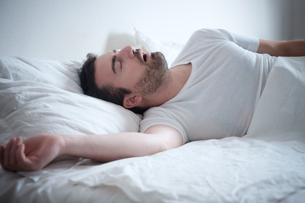 man-snoring-loud-sleep-bed-dangers