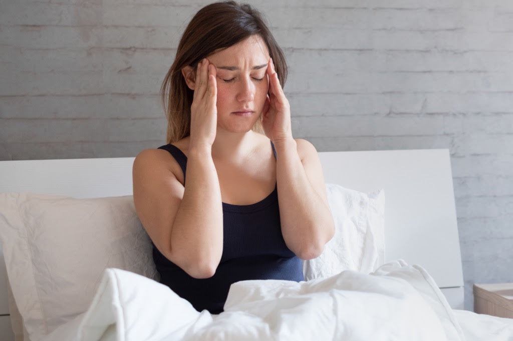 Woman unhappy in bed with lack of sleep symptoms